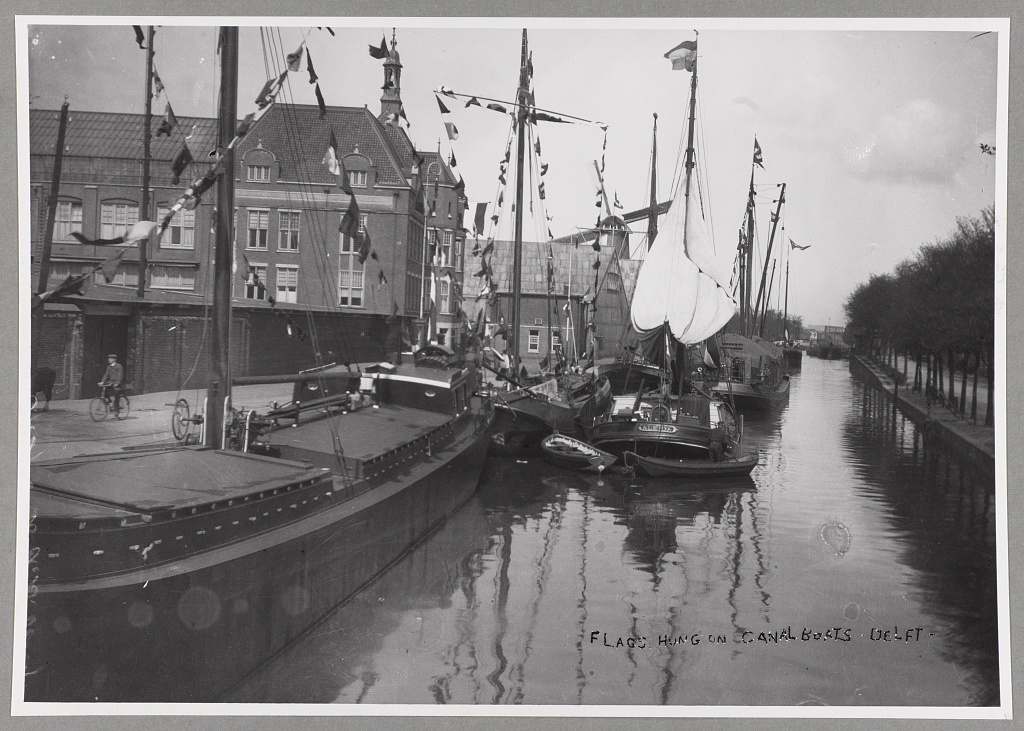 Flags hung on canal boats. T. R. Roosevelt, Delft, Holland.